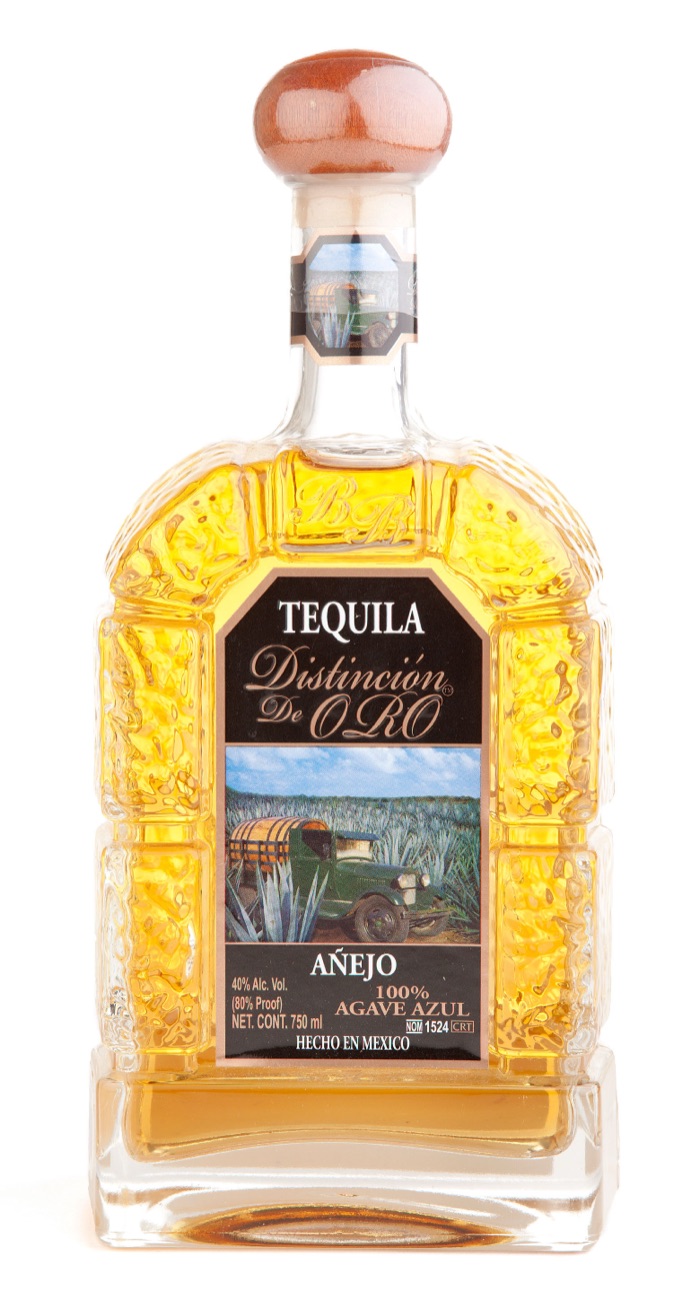Distinción de Oro Añejo tequila in an ornate gold-embossed bottle, NOM 1524